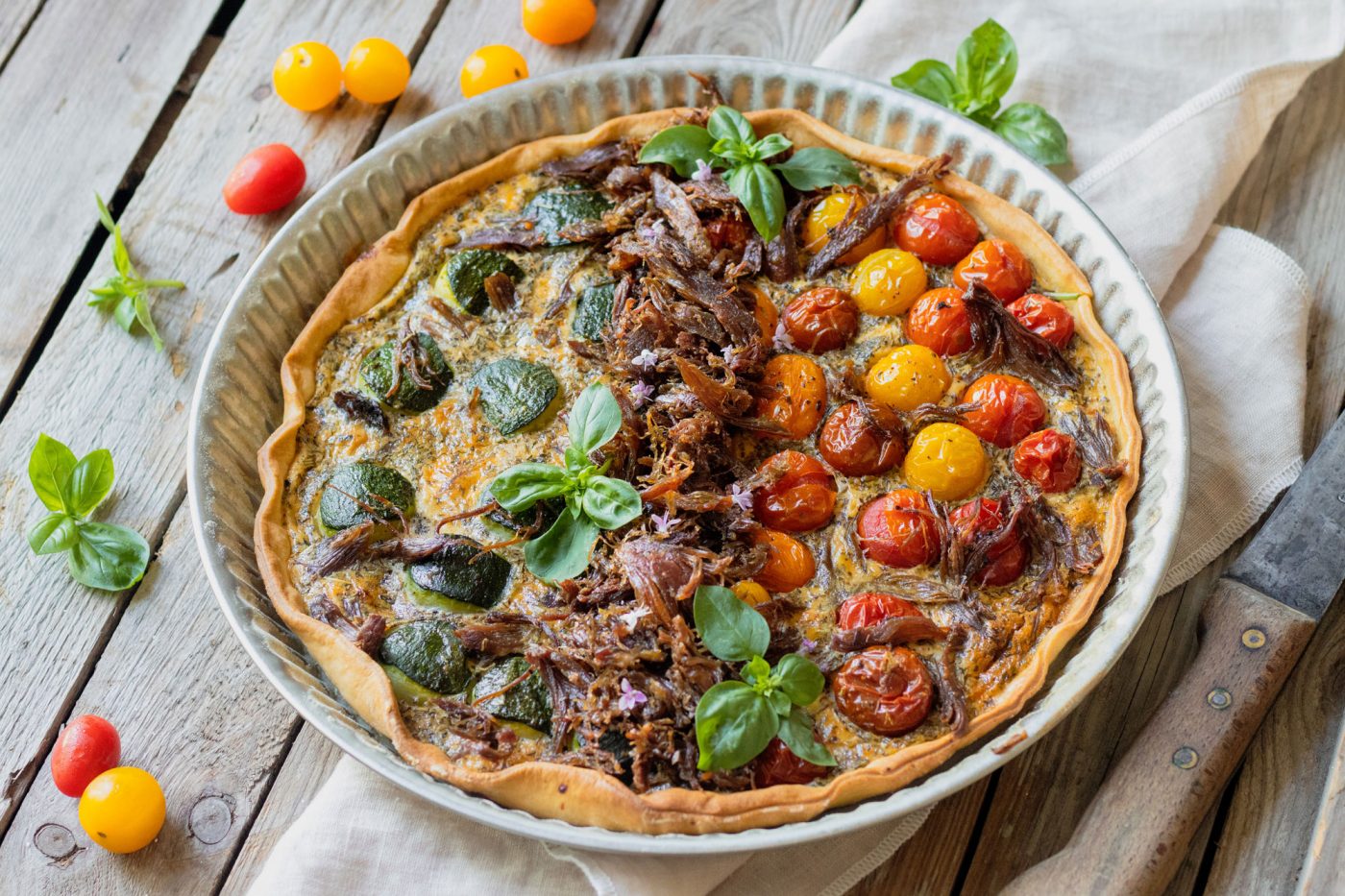Recette de tarte au Confit de Canard Fermier des Landes, courgettes et tomates cerises
